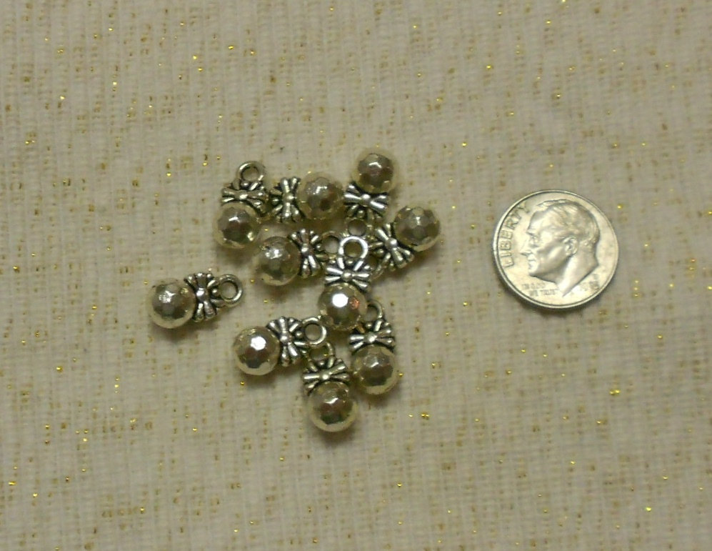 Unique Silver Faceted Ball With Bow Drop Charms